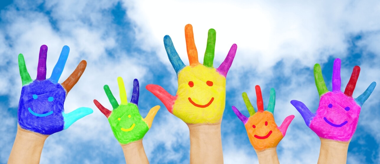 kids hands painted in all different colors and with smiley faces