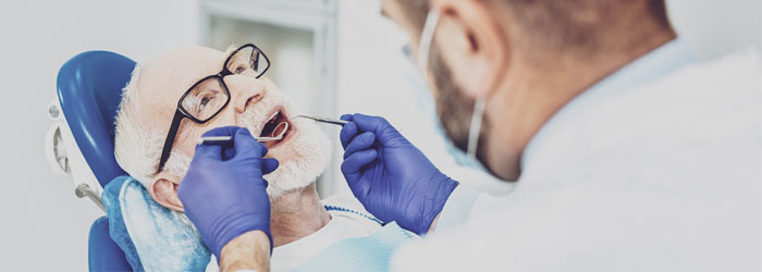 senior man in dentist chair