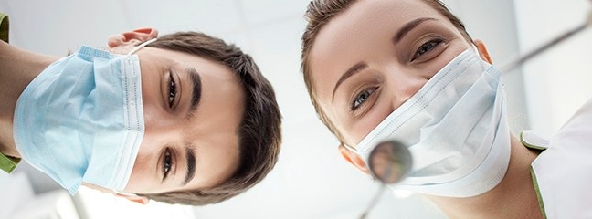 two dentists looking at camera
