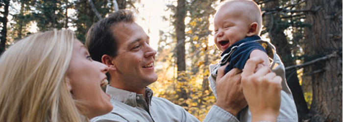 mother and father with baby - healthy eyes