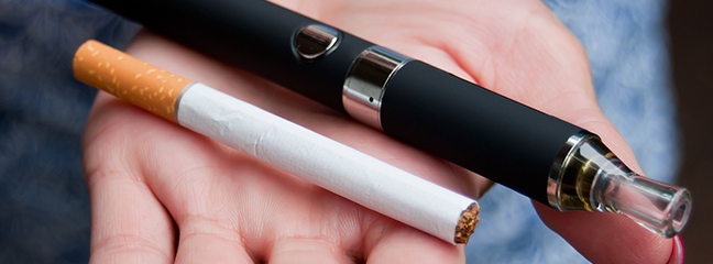 hand holding cigarette and vape