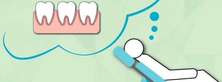 tooth statue standing next to a dental mirror