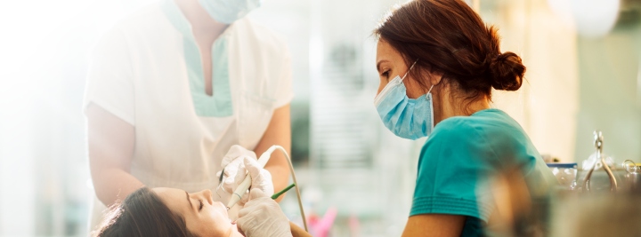 girl getting dental cleaning