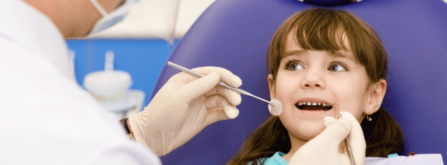 young girl at the dentist