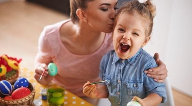 mother playing with baby