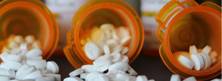 bottles of opioids spilled