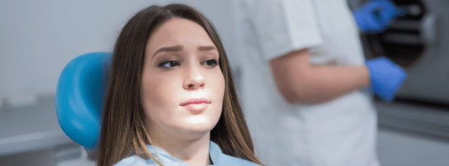 Nervous girl in dentist office