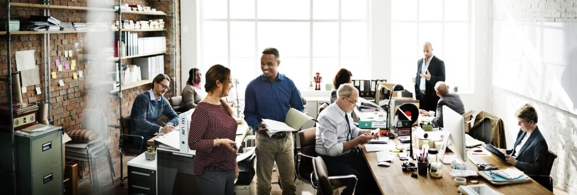 employees working in a small office