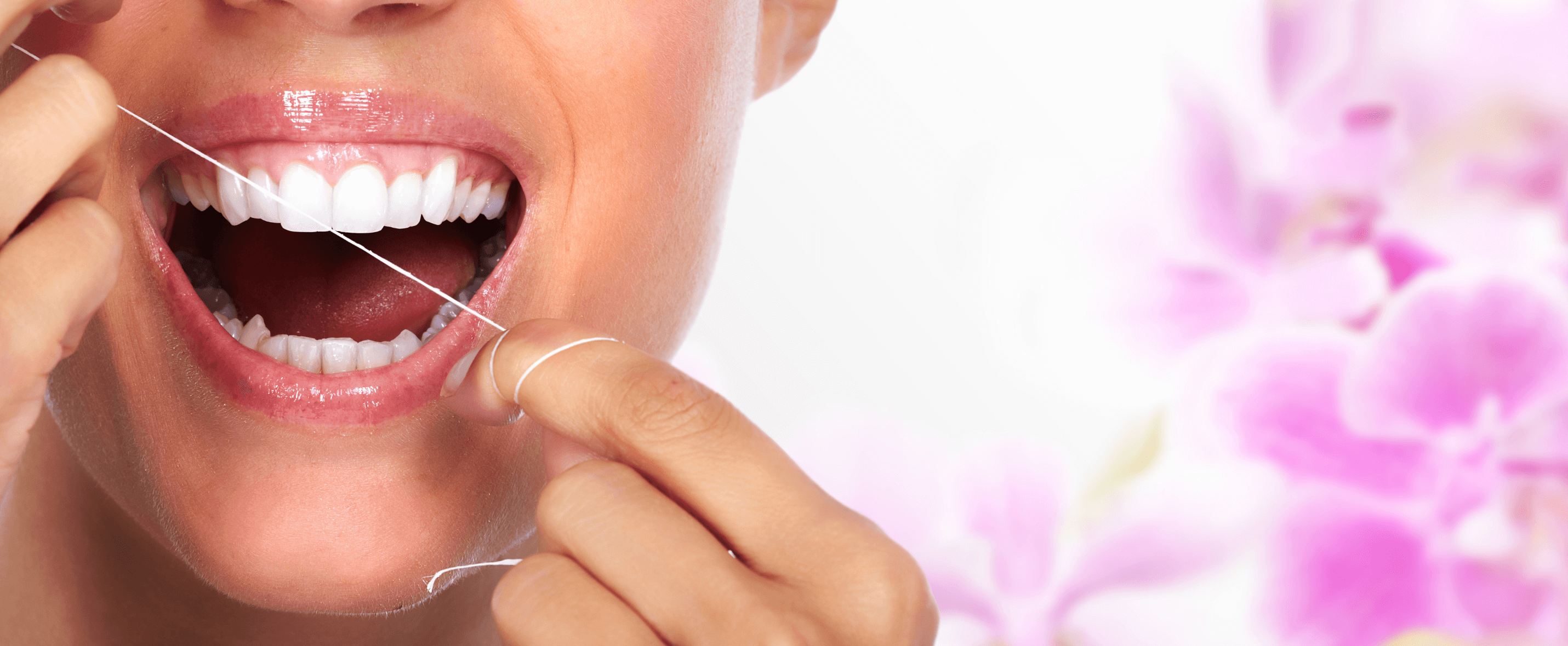 woman flossing her teeth