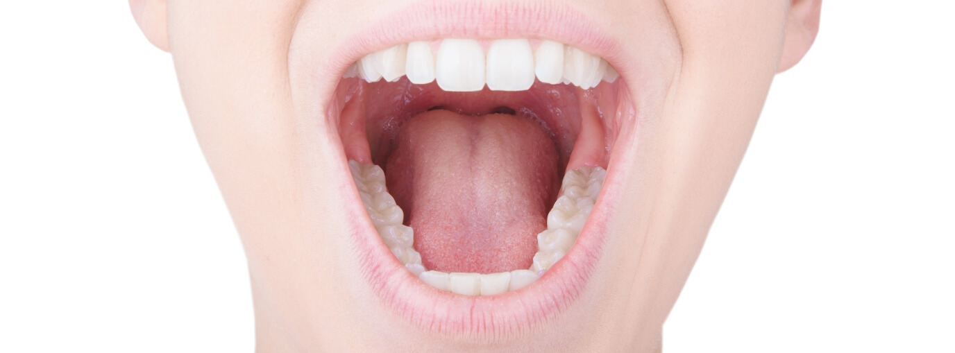 close up of woman's mouth open wide