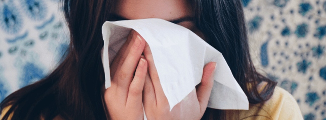 Girl sneezing