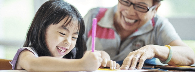 young girl smiling taking a quiz