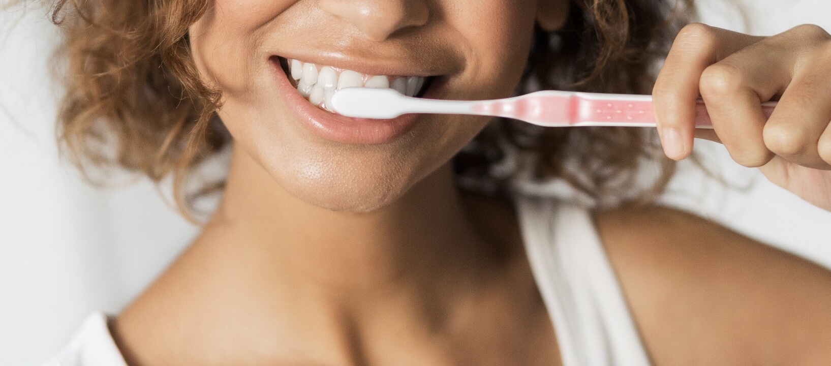 woman brushing teeth