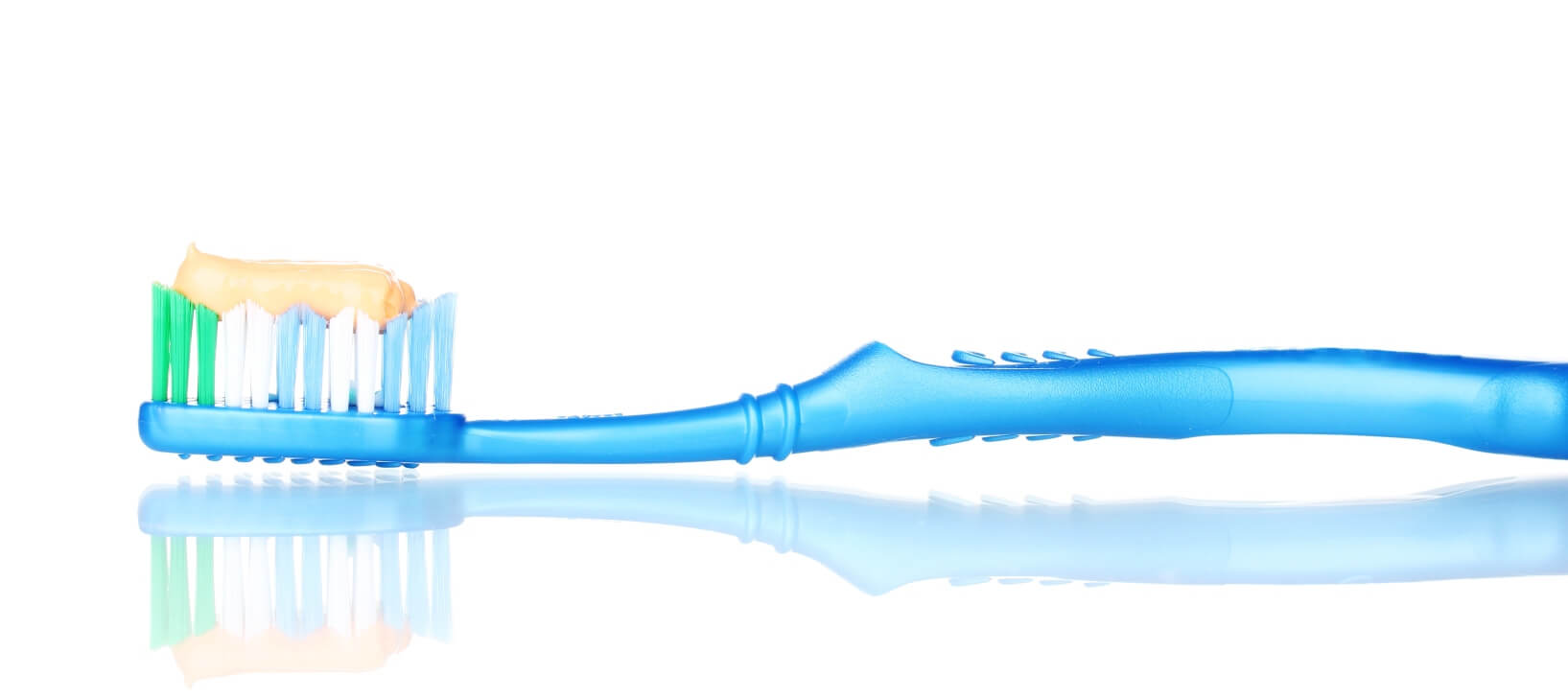 toothbrush with fluoride toothpaste on it