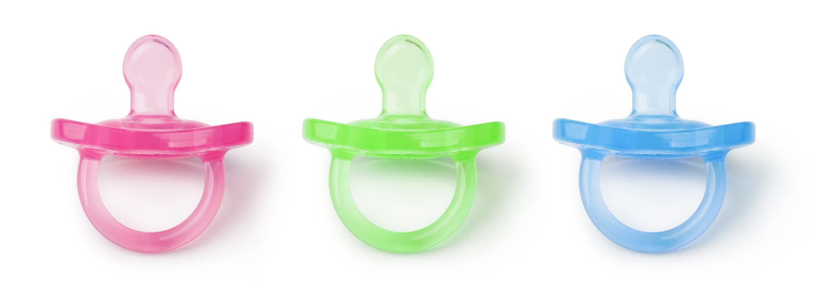 3 pacifiers: pink, green and blue lined up in a row