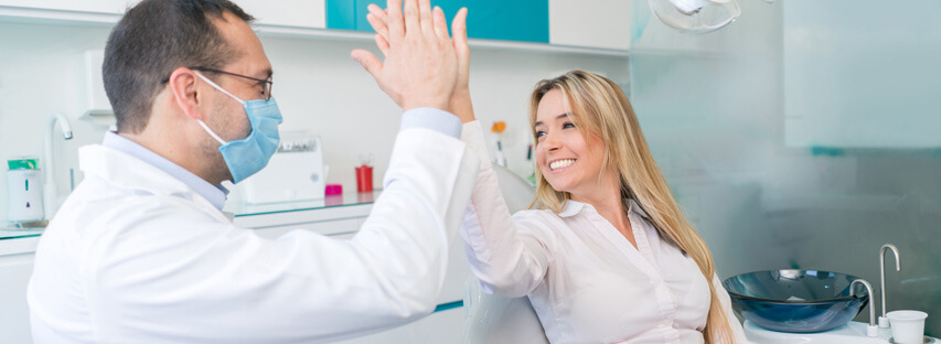 woman giving high five to dentist