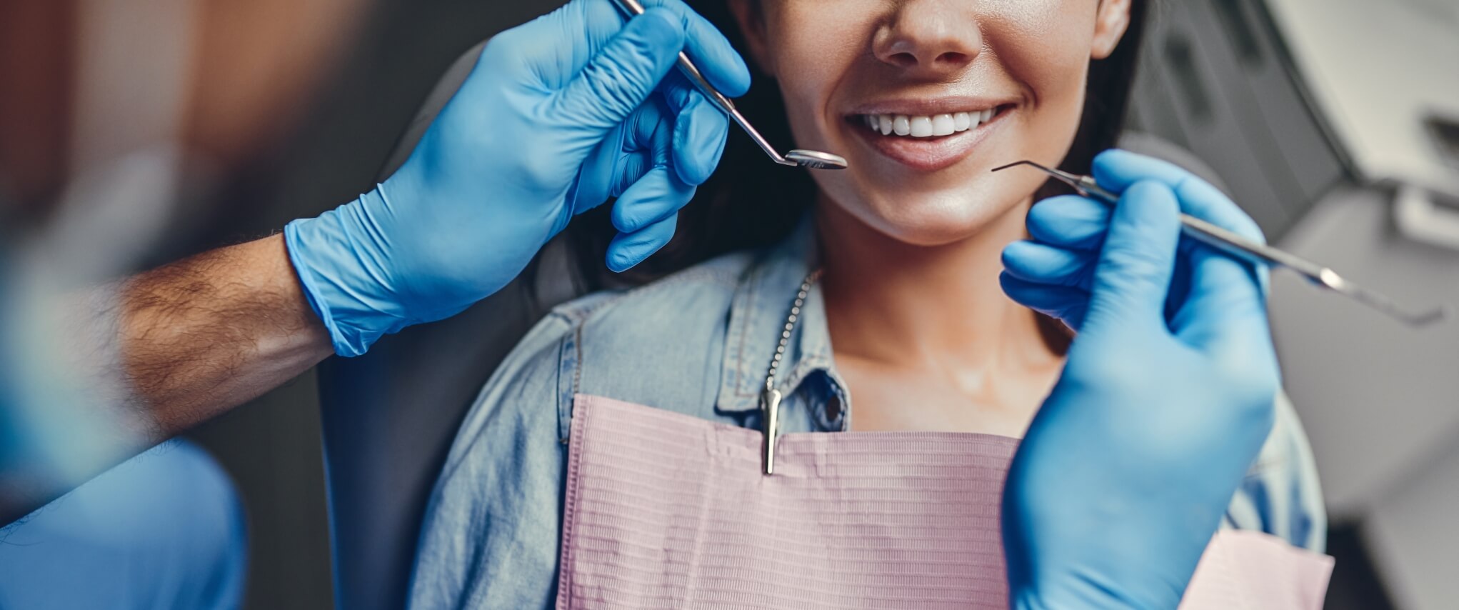 woman in dentist chair smiling